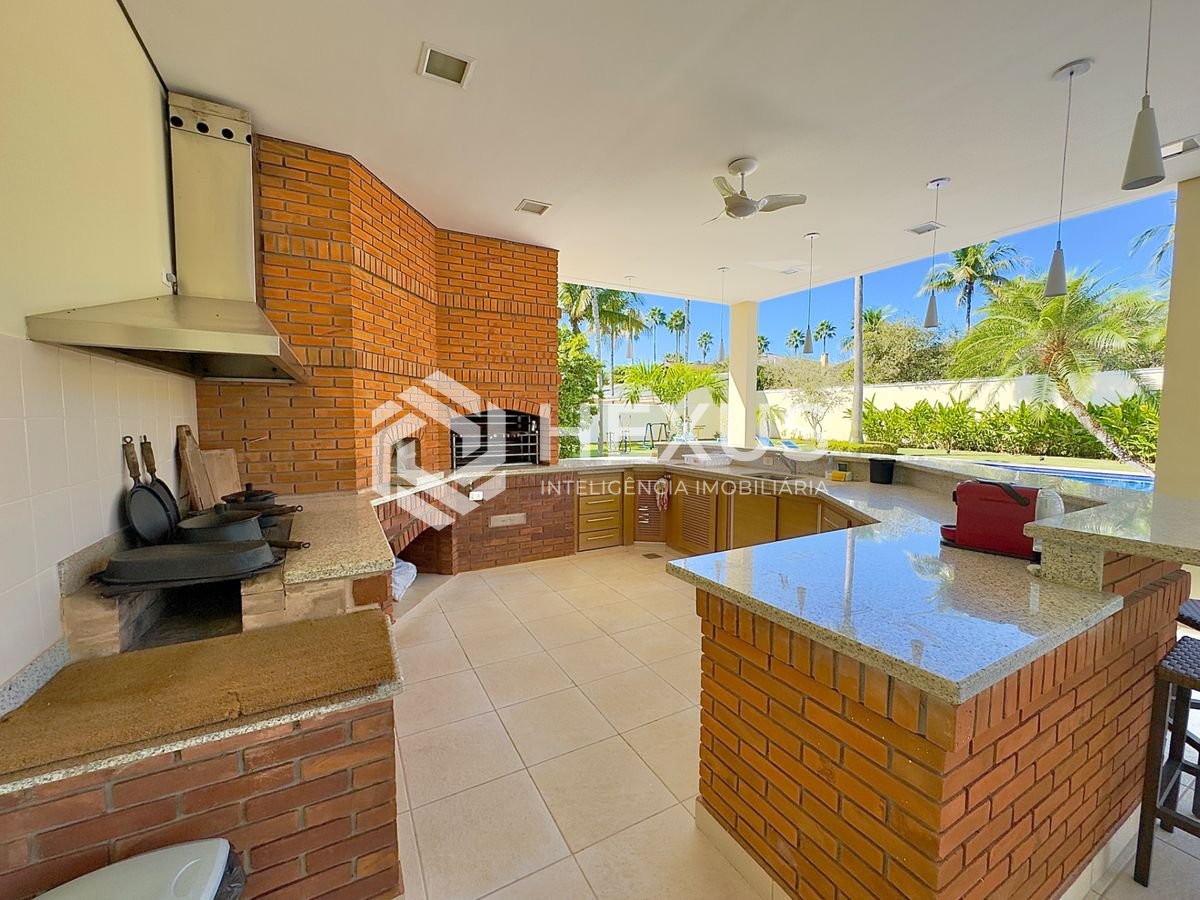 Foto 5 de Casa reformada com piscina e área gourmet no Jardim Acapulco, Guarujá