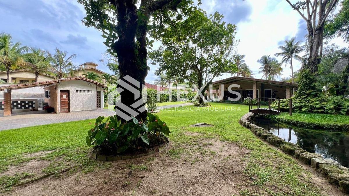 Foto 4 de Casa com lago área gourmet e piscina no Jardim Guaiuba, Guarujá