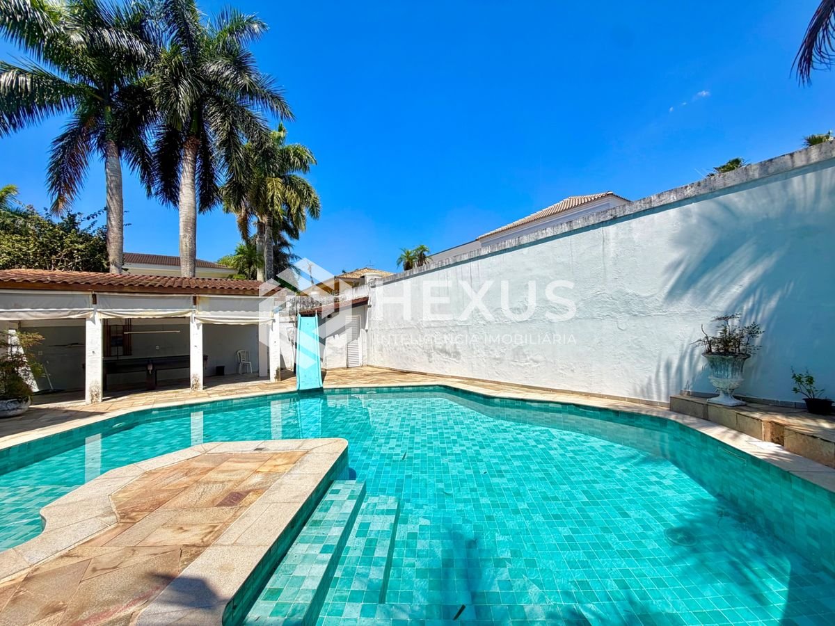 Foto 3 de Casa com piscina e área gourmet no Condomínio Jardim Acapulco, Guaruja