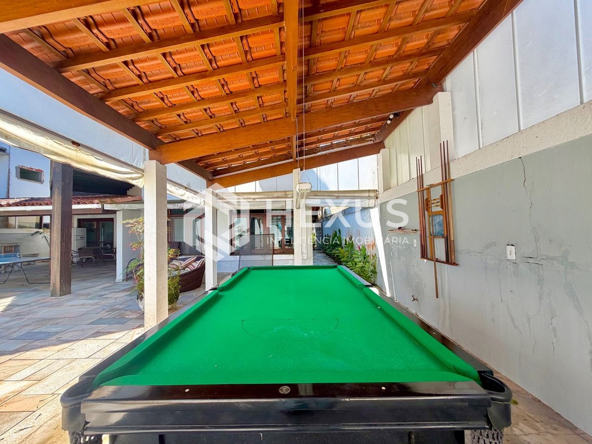 Foto 4 de Casa com piscina e área gourmet no Condomínio Jardim Acapulco, Guaruja