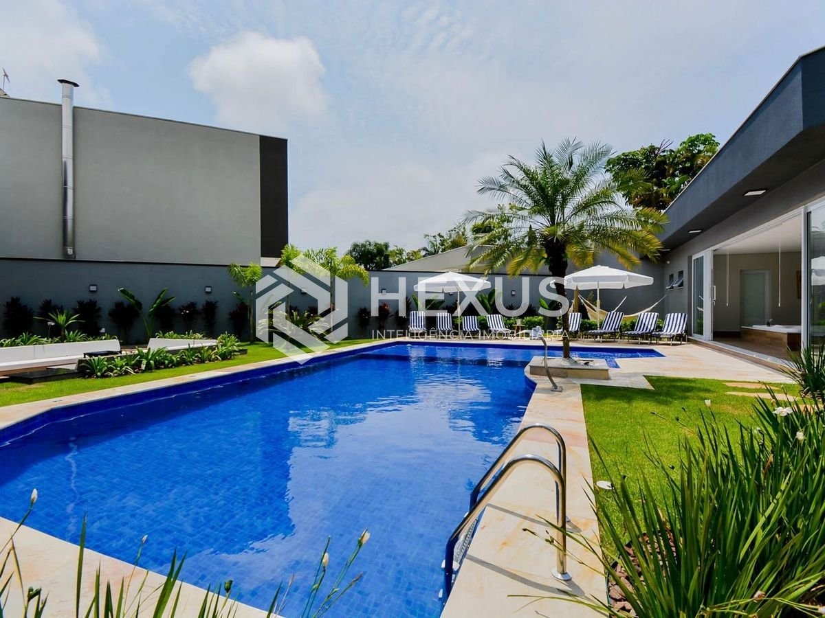 Foto 3 de Casa de alto padrão com piscina e área gourmet no Jardim Acapulco à venda, Guarujá-SP.