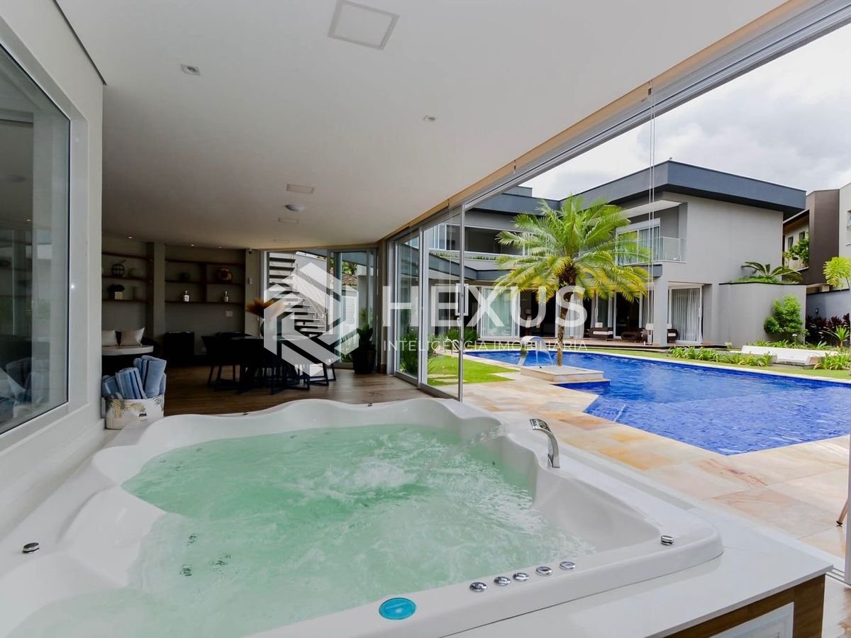 Foto 4 de Casa de alto padrão com piscina e área gourmet no Jardim Acapulco à venda, Guarujá-SP.
