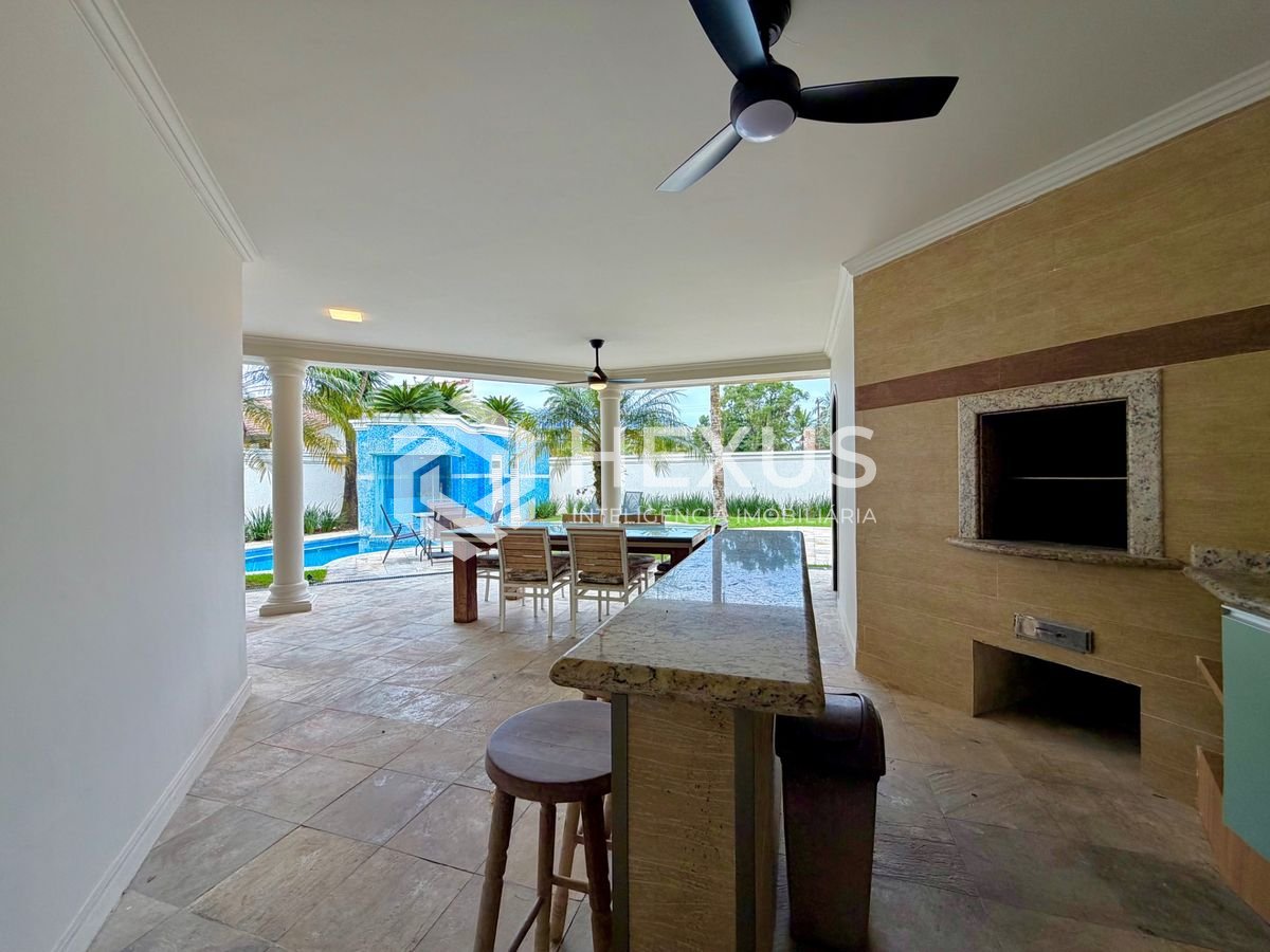 Foto 4 de Casa de alto padrão com piscina e área gourmet no Jardim Acapulco, Guarujá.