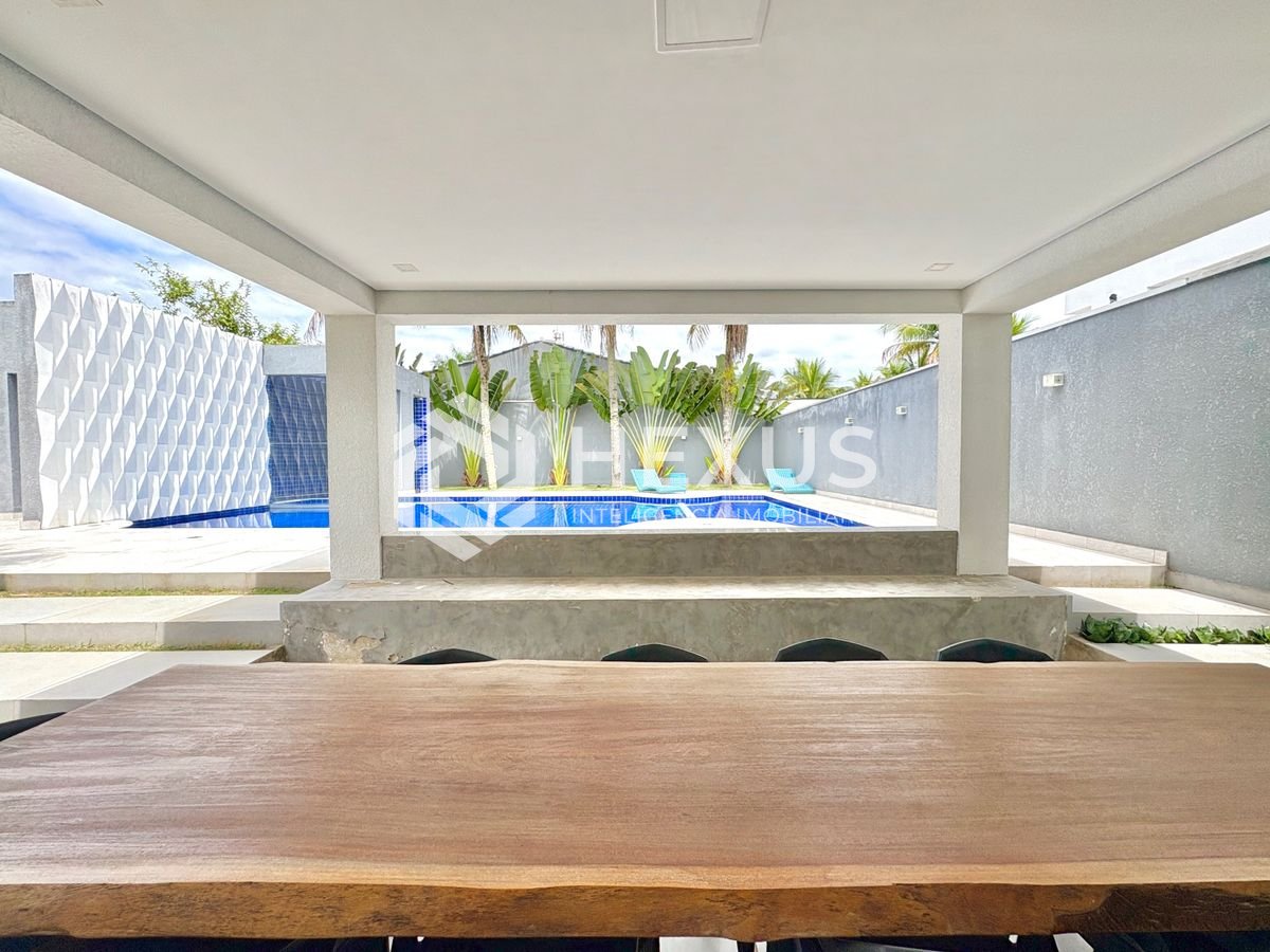 Foto 4 de Casa reformada com piscina e área gourmet no Jardim Acapulco, Guarujá