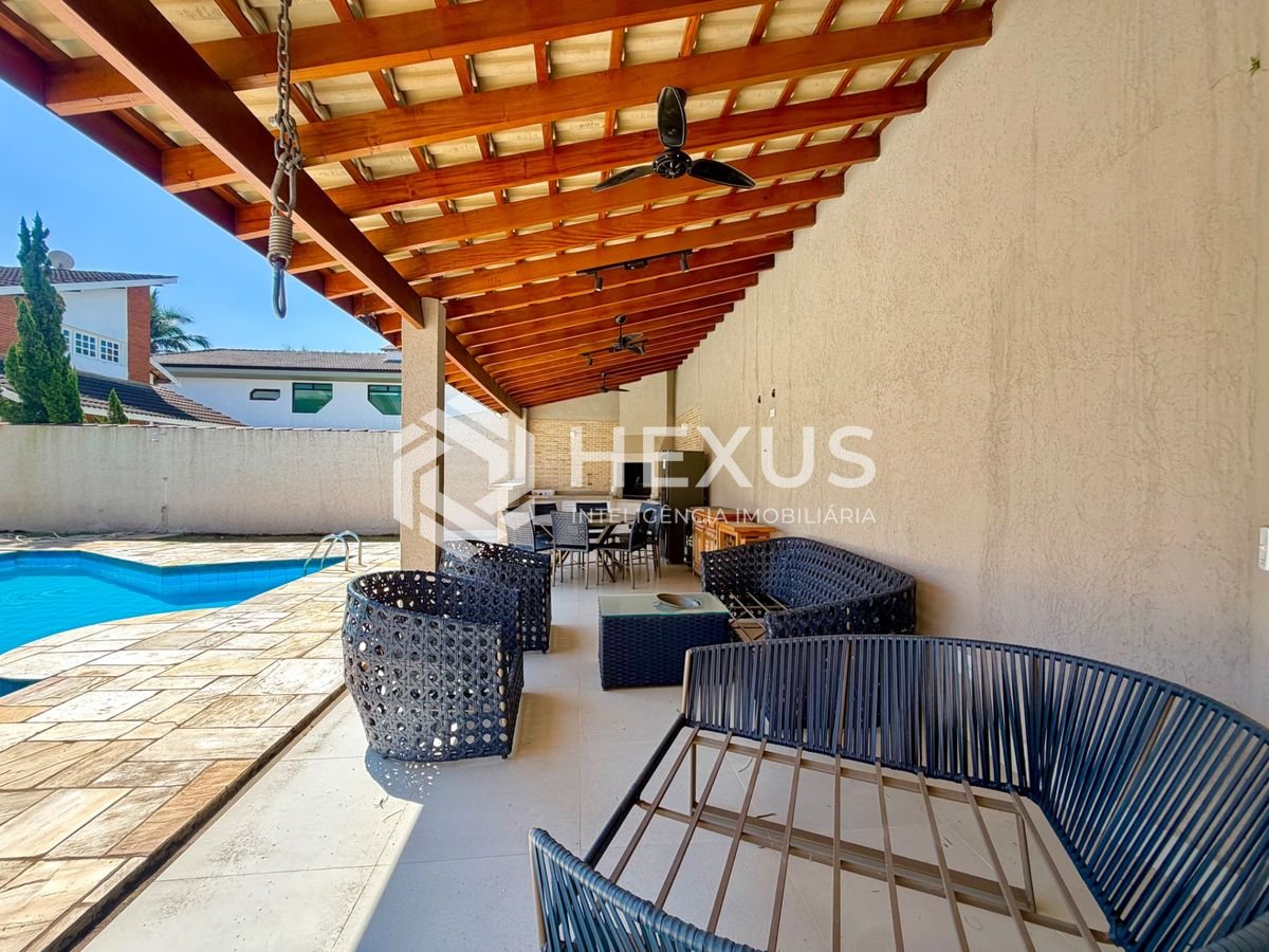 Foto 4 de Casa de alto padrão com piscina e área gourmet no Jardim Acapulco, Guarujá.