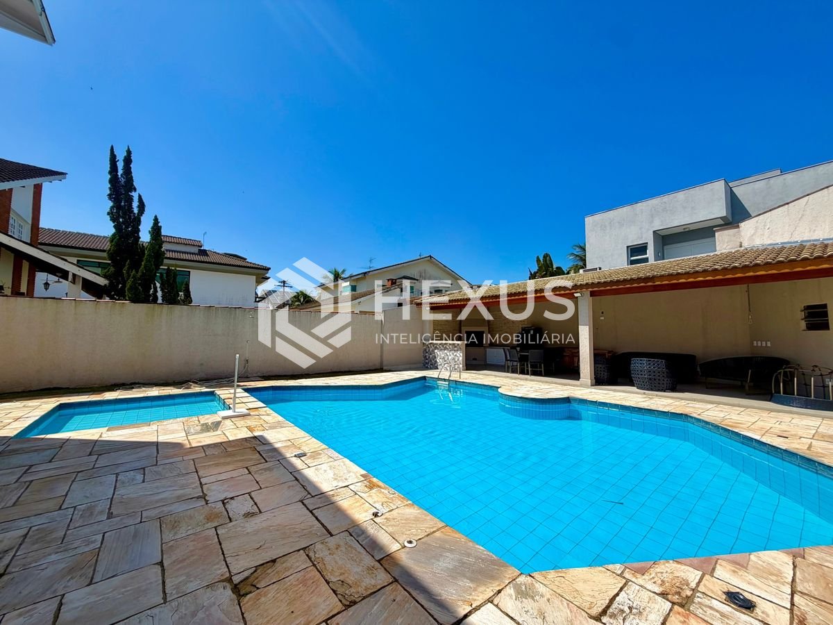 Foto 5 de Casa de alto padrão com piscina e área gourmet no Jardim Acapulco, Guarujá.