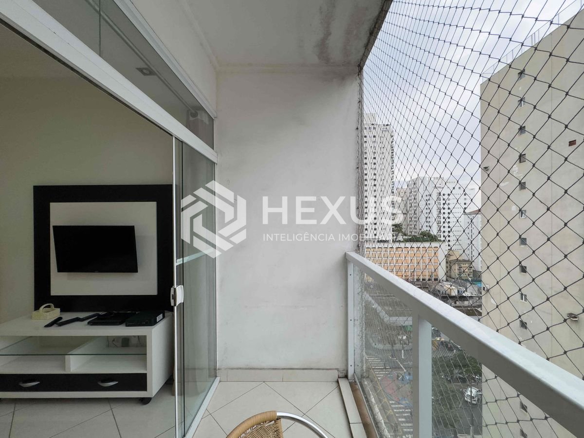 Foto 4 de Apartamento com varanda e vista livre a uma quadra da Praia das Pitangueiras de 2 quartos com 1 vaga, Guarujá-SP