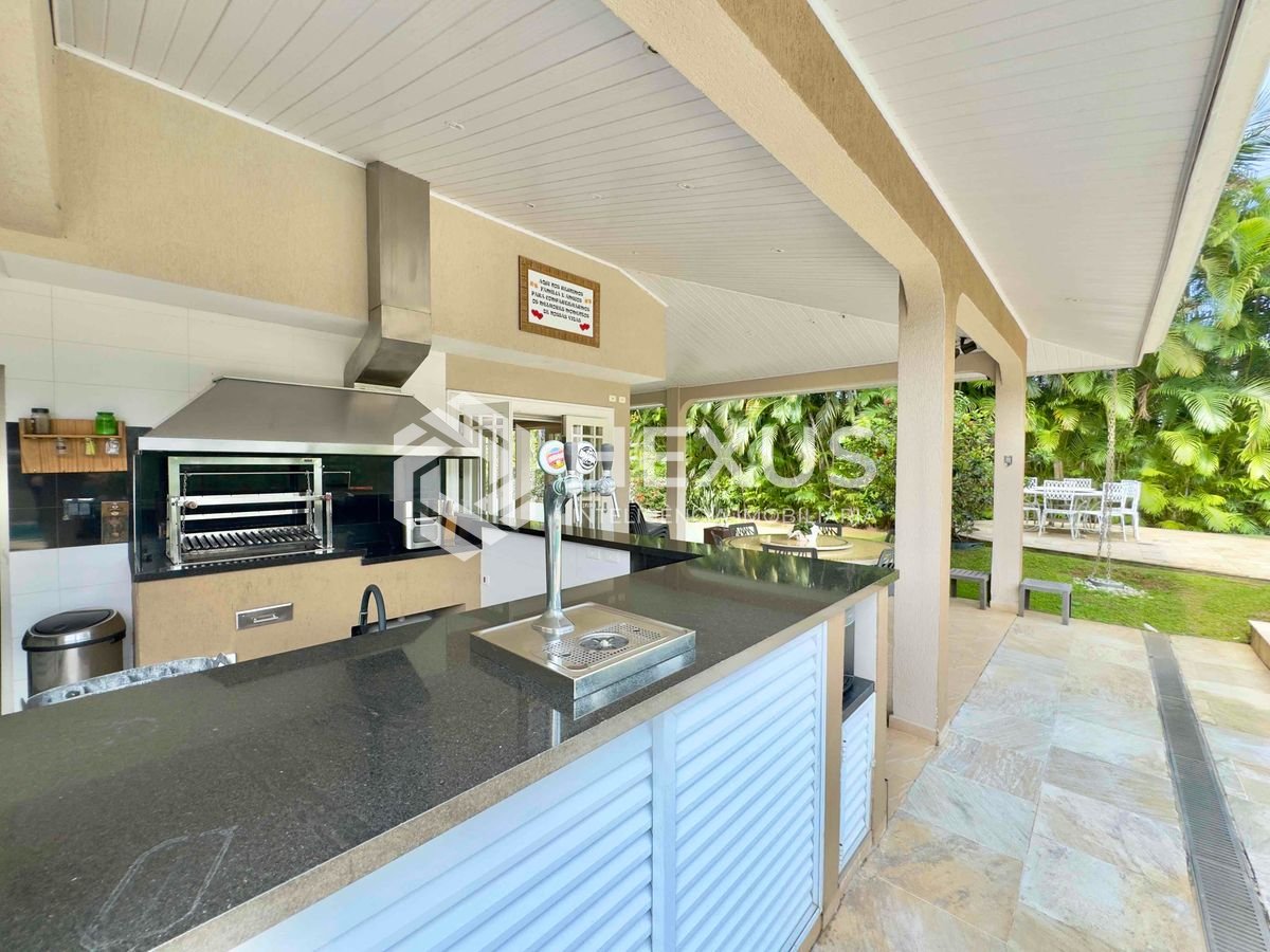Foto 4 de Casa reformada com varanda piscina e área gourmet no Granville na Praia da Enseada, Guaruja