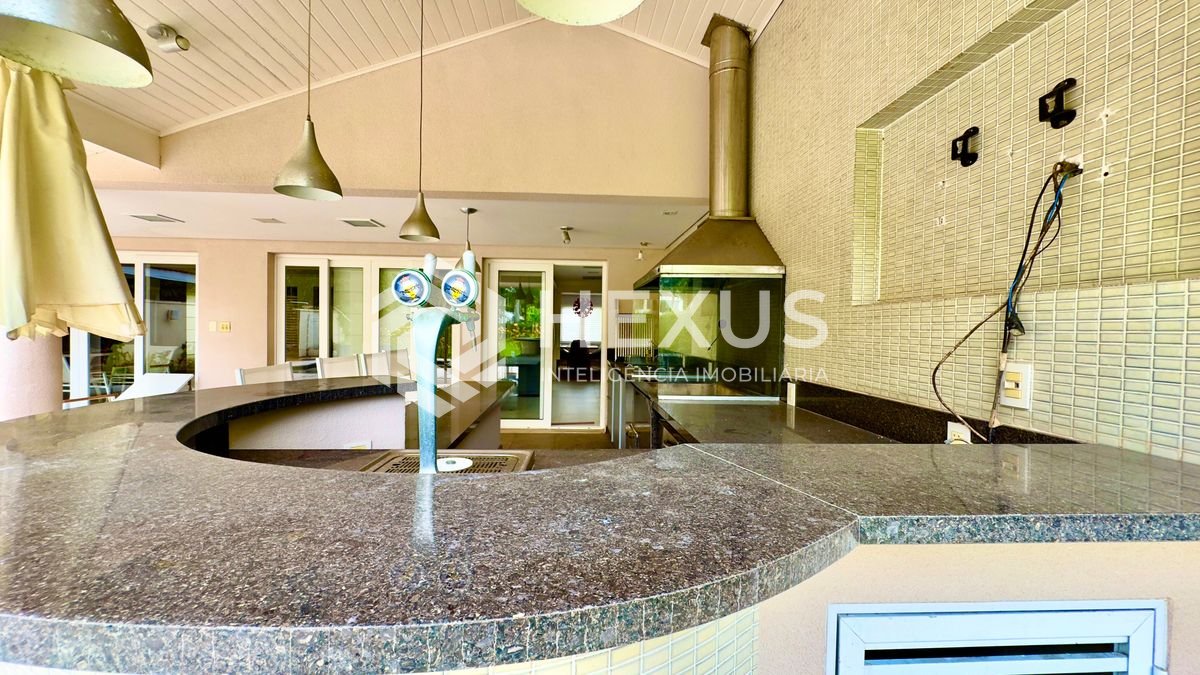 Foto 3 de Casa reformada com piscina e área gourmet no Jardim Pernambuco I, Guarujá