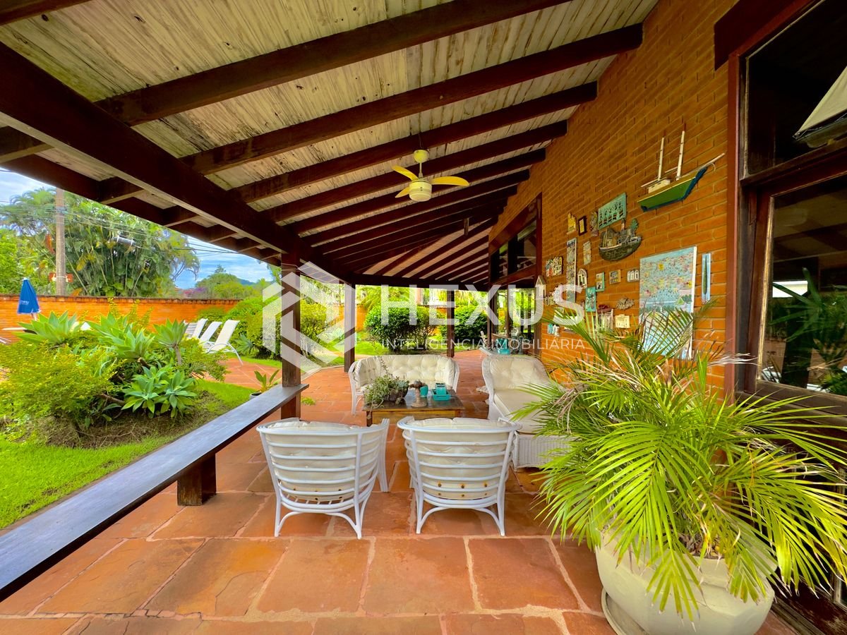 Foto 2 de Casa Rústica com piscina e área gourmet no Jardim Acapulco, Guaruja