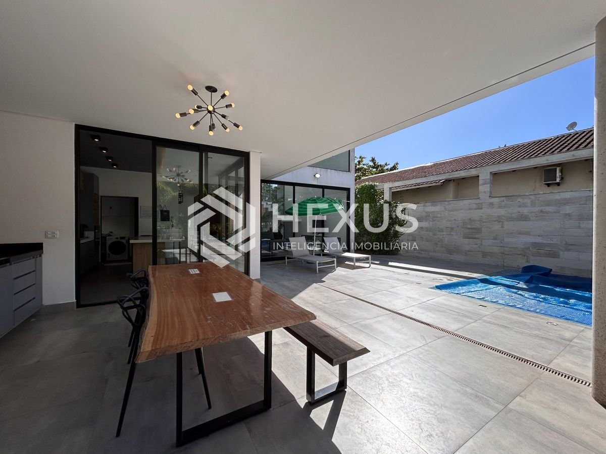 Foto 4 de Casa de alto padrão com 4 suítes e piscina área gourmet no Jardim Pernambuco, Guarujá