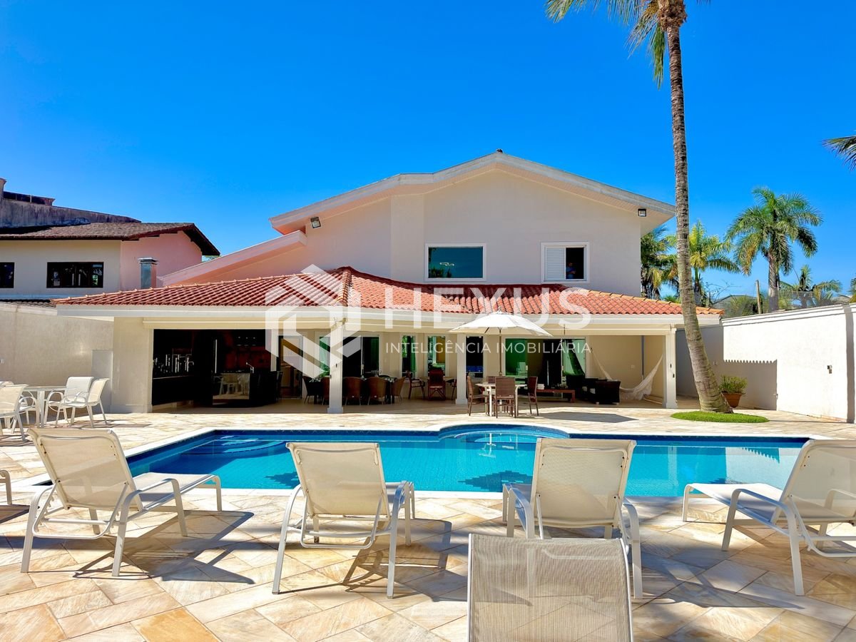 Foto 5 de Casa de alto padrão com varanda piscina e área gourmet no Jardim Acapulco, Guarujá