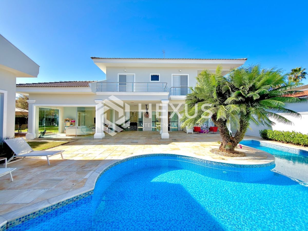 Foto 3 de Casa reformada com piscina e área gourmet no Jardim Acapulco, Guarujá
