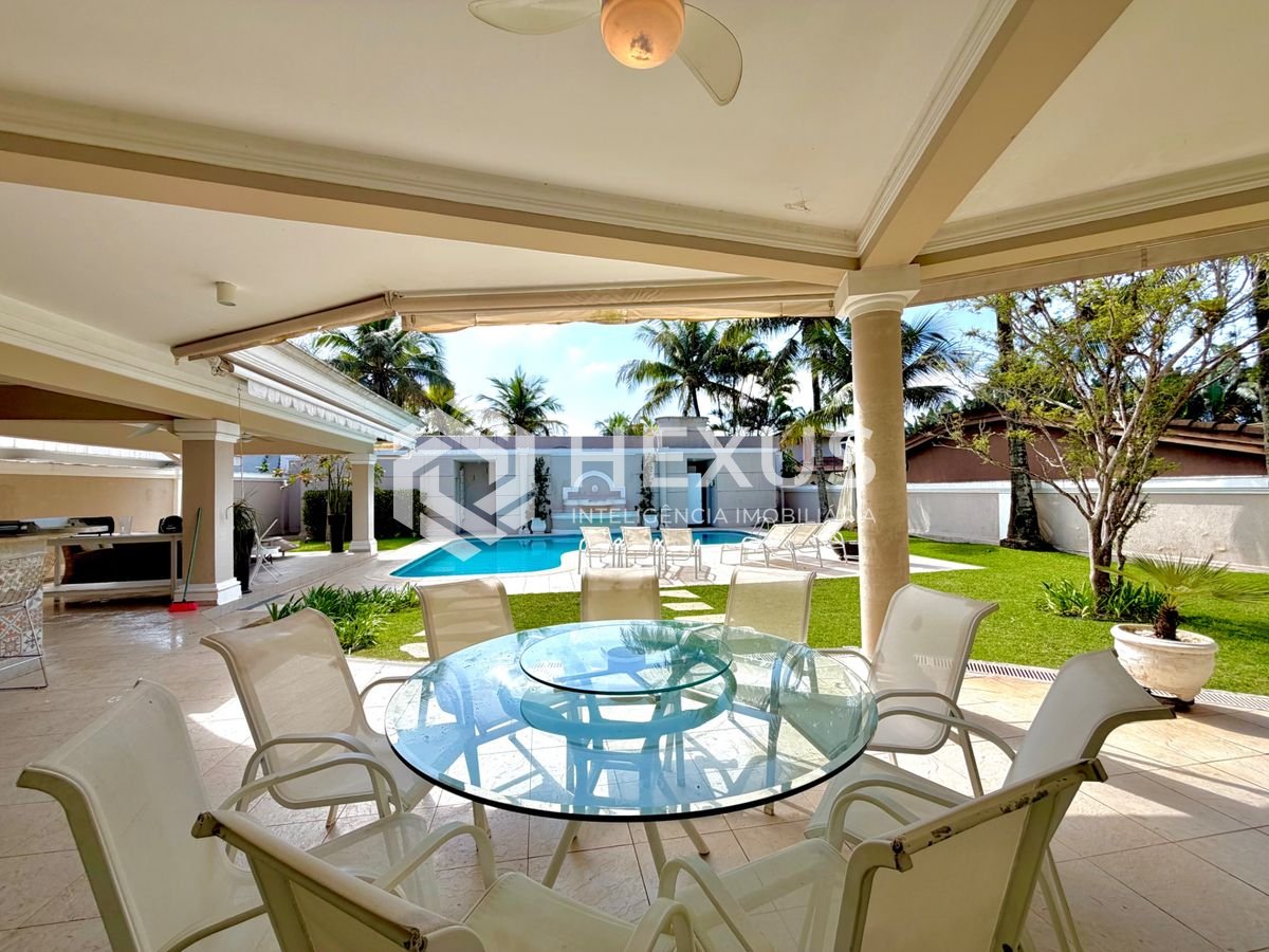 Foto 3 de Casa com piscina e área gourmet no Condomínio Jardim Acapulco no Pernambuco, Guarujá