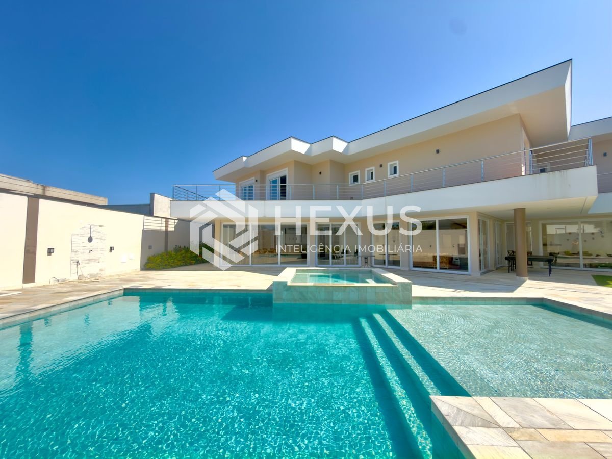 Foto 4 de Casa de alto padrão com piscina e área gourmet no Jardim Acapulco, Guarujá.