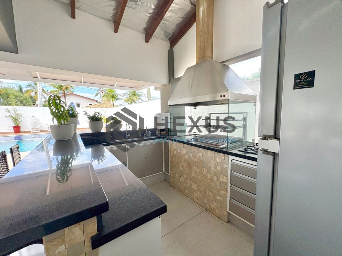 Foto 8 de Casa reformada com piscina e área gourmet no Jardim Acapulco, Guarujá