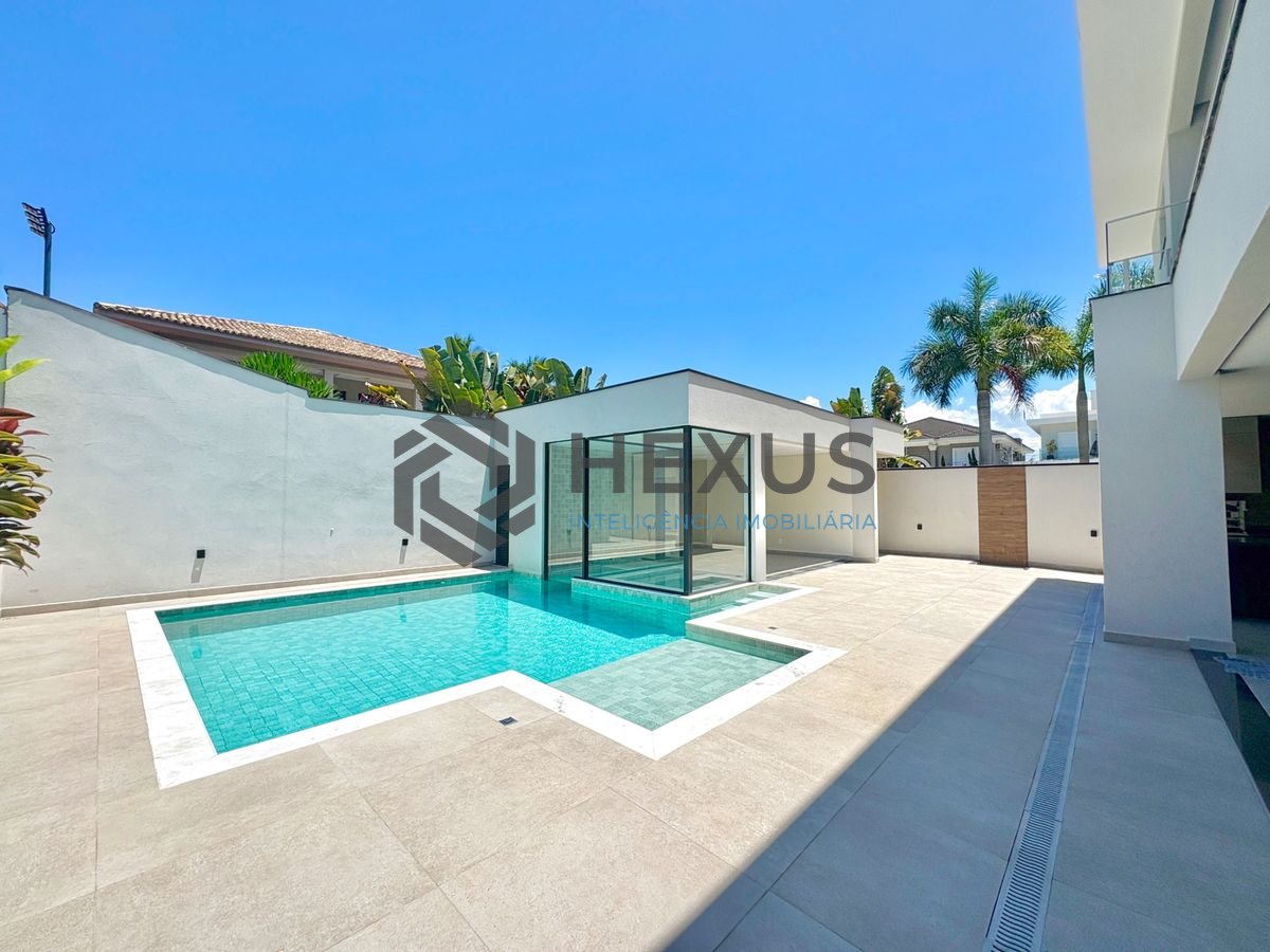 Foto 2 de Casa reformada com piscina e área gourmet no Jardim Acapulco, Guarujá