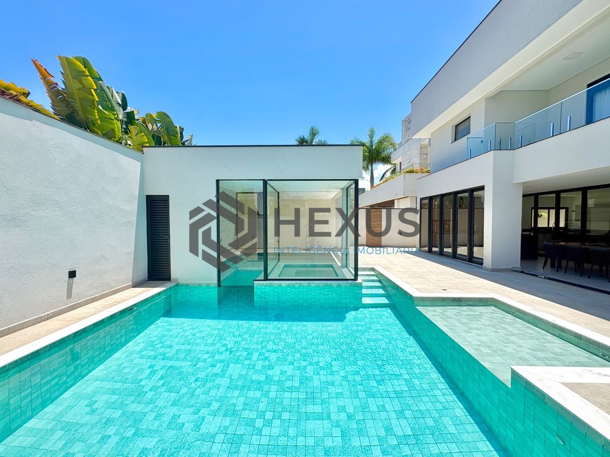 Foto 10 de Casa reformada com piscina e área gourmet no Jardim Acapulco, Guarujá