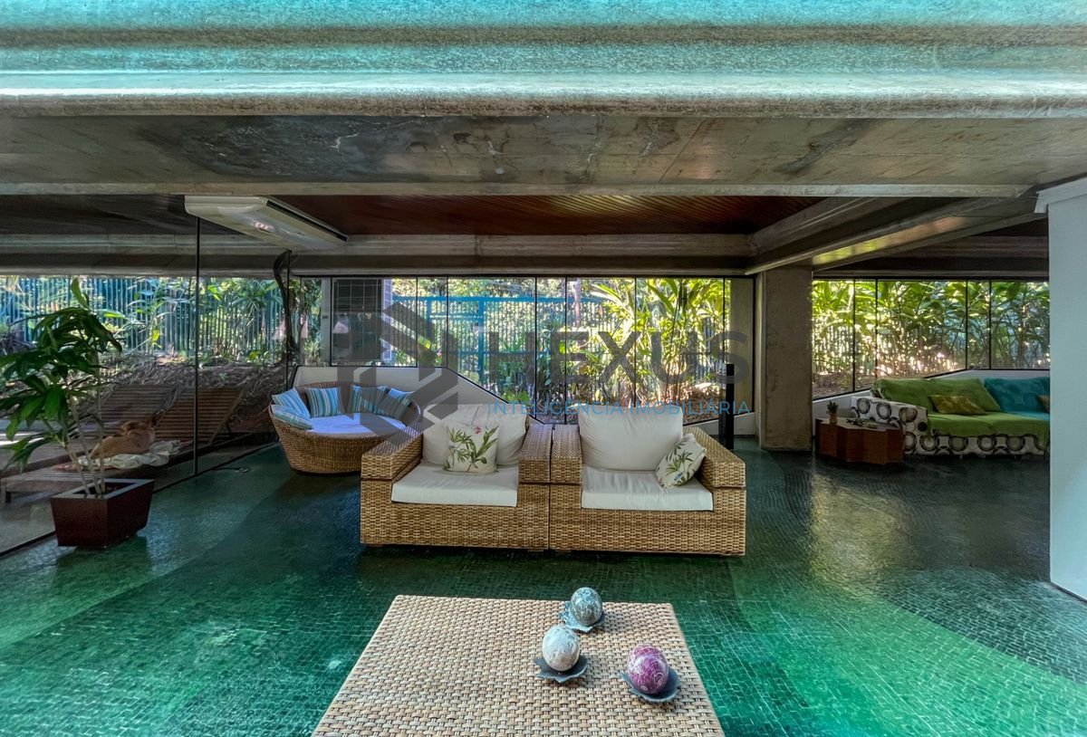 Foto 4 de Casa térrea moderna com piscina e jardim, no Balneário Pernambuco, Guarujá