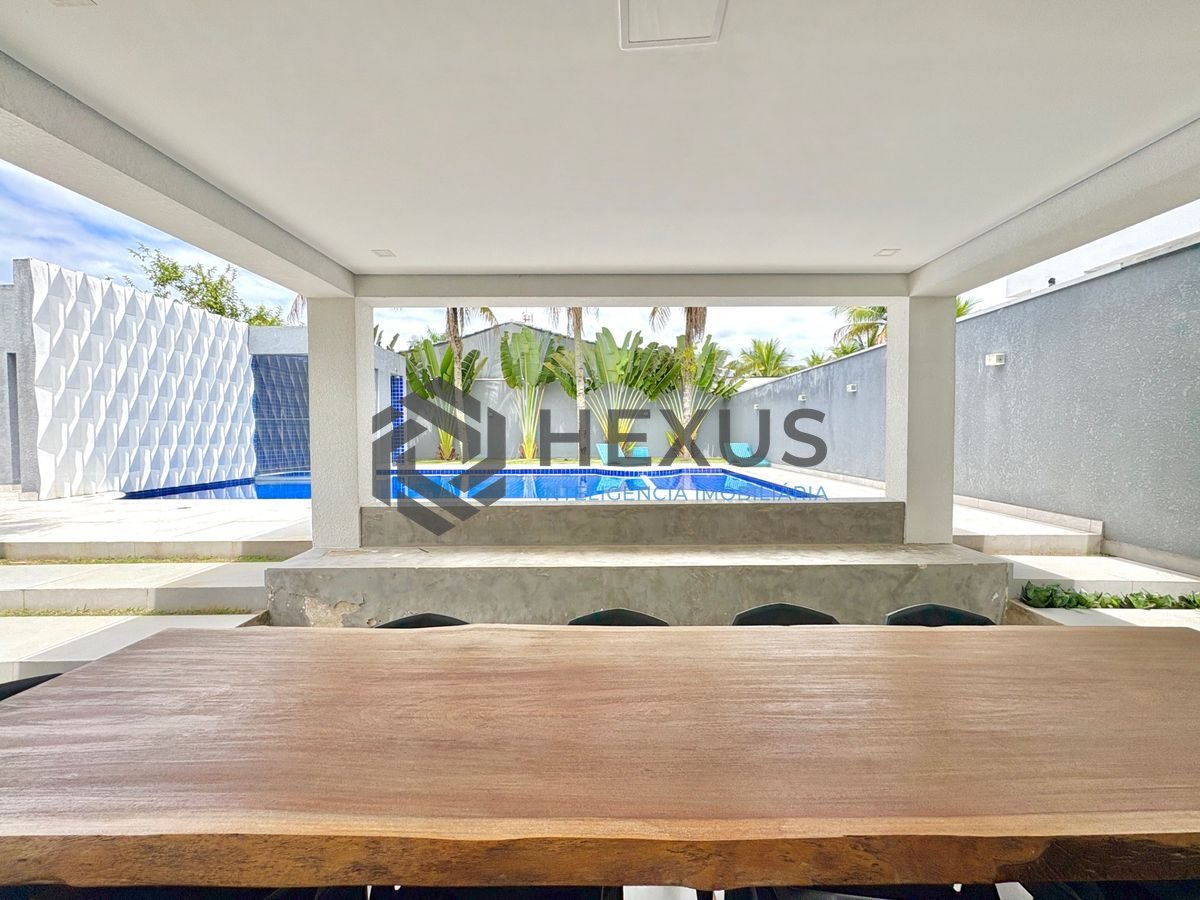 Foto 4 de Casa reformada com piscina e área gourmet no Jardim Acapulco, Guarujá
