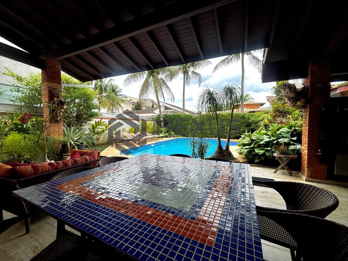 Foto 8 de Casa reformada com piscina e área gourmet no Jardim Acapulco, Guarujá
