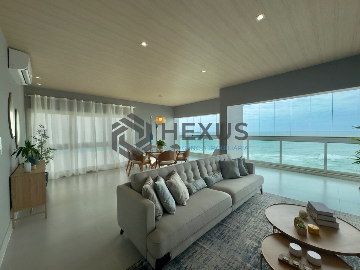 Foto 11 de Apartamento reformado frente mar com varanda e lazer na Praia das Pitangueiras, Guaruja