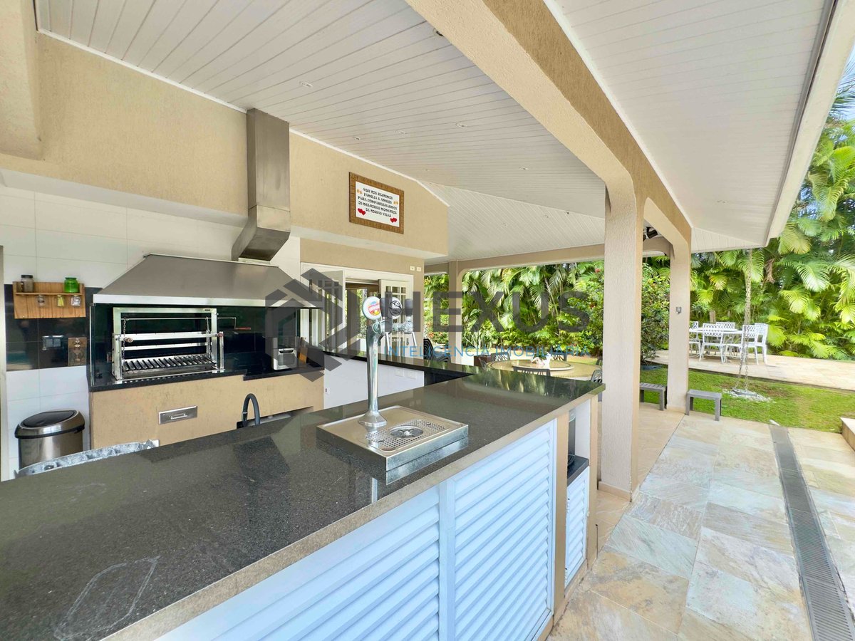 Foto 4 de Casa reformada com varanda piscina e área gourmet no Granville na Praia da Enseada, Guaruja