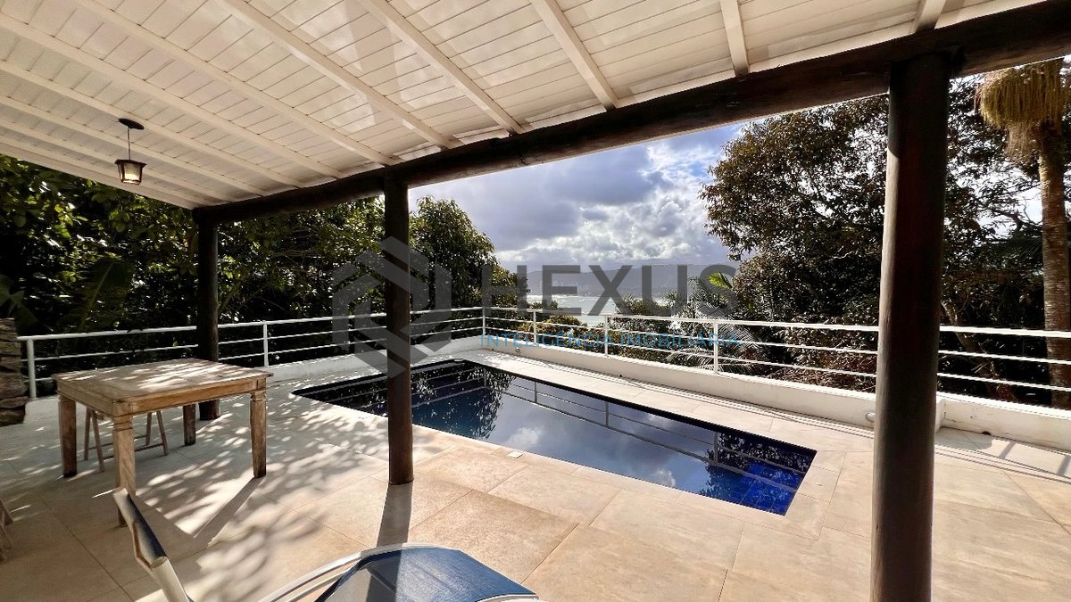 Foto 6 de Casa frente mar com piscina e área gourmet no Condomínio Península na Praia da Enseada, Guaruja