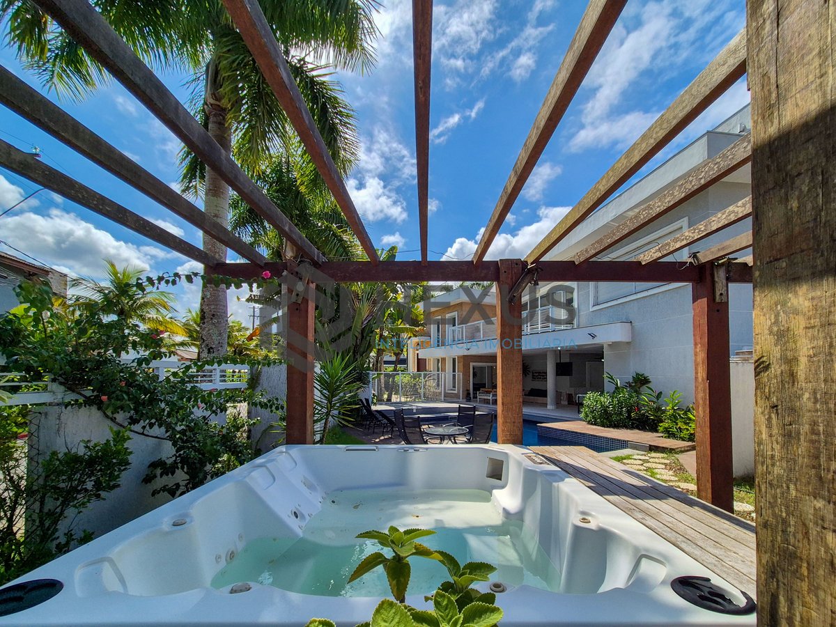 Foto 11 de Casa reformada com piscina e área gourmet no Jardim Pernambuco I, Guarujá