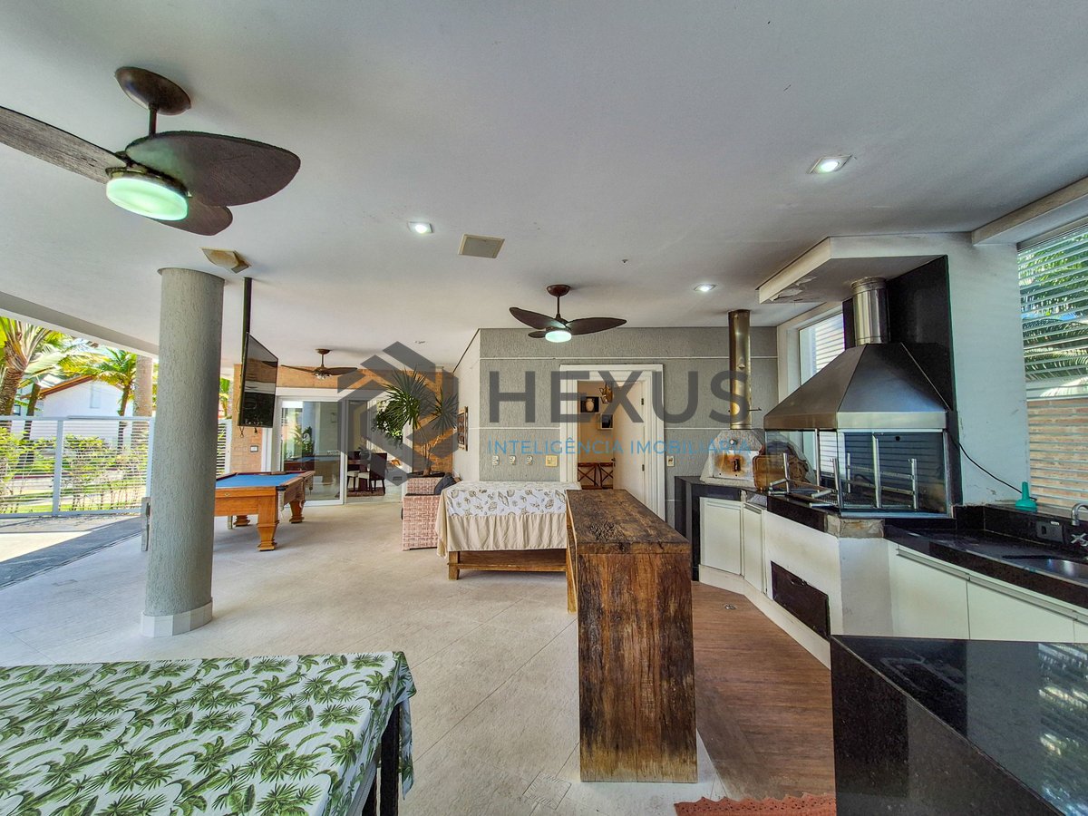 Foto 18 de Casa reformada com piscina e área gourmet no Jardim Pernambuco I, Guarujá