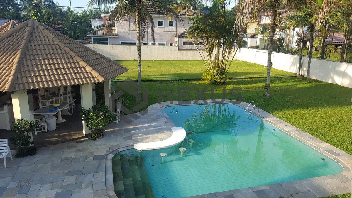 Foto 7 de Casa reformada com piscina e área gourmet no Jardim Acapulco, Guarujá