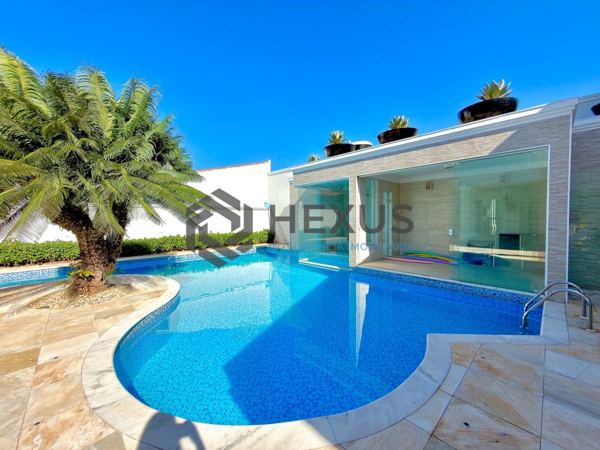 Foto 9 de Casa reformada com piscina e área gourmet no Jardim Acapulco, Guarujá