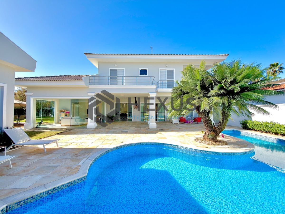 Foto 3 de Casa reformada com piscina e área gourmet no Jardim Acapulco, Guarujá