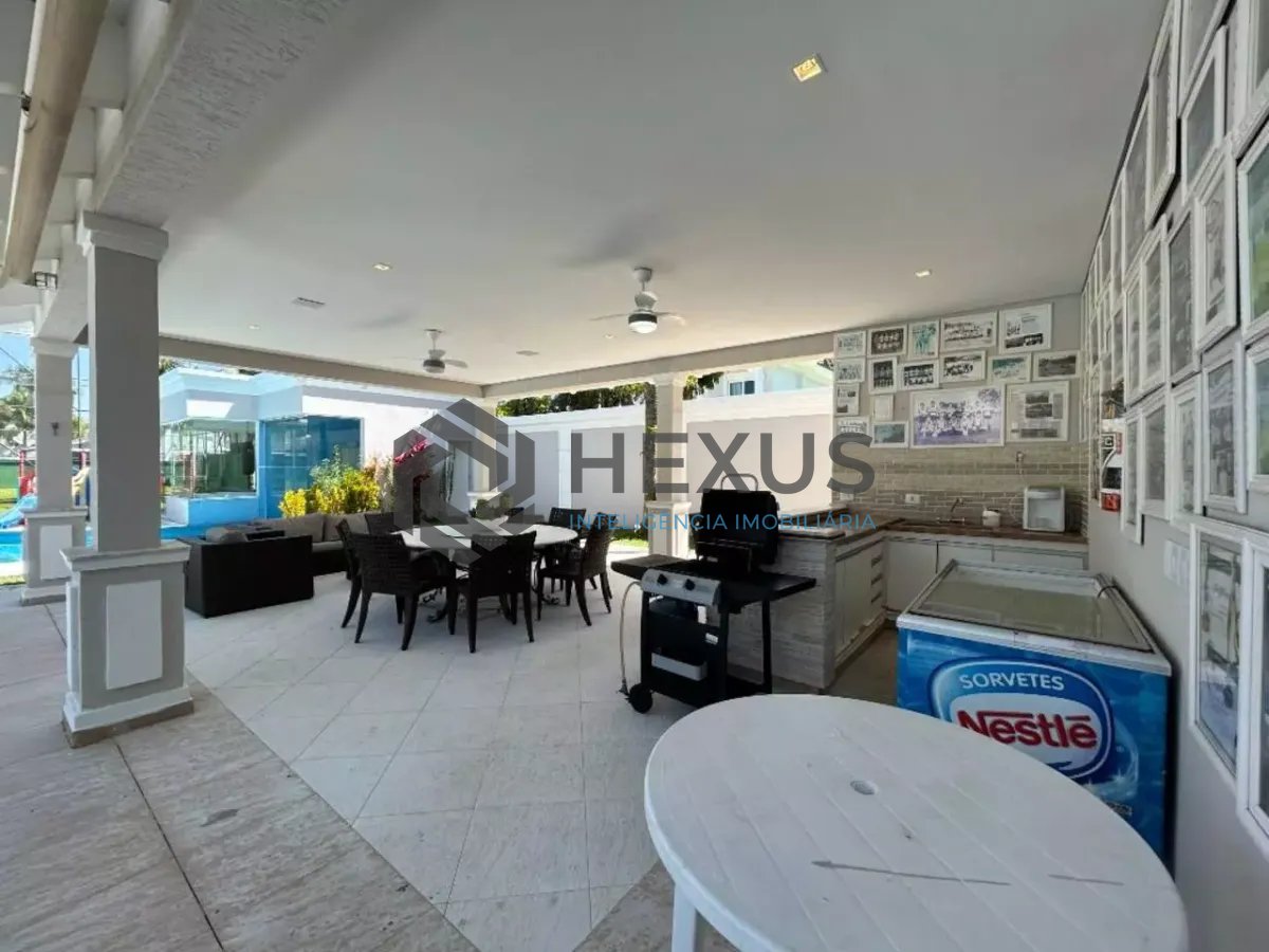 Foto 4 de Casa reformada com piscina e área gourmet no Jardim Acapulco, Guarujá